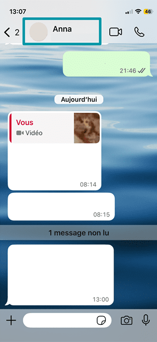 An WhatsApp chat on iOS, with the name of the participant on the other end highlighted.